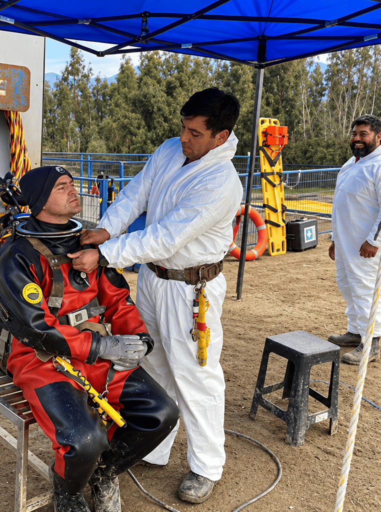 Preparación de un buzo comercial con traje seco antes de una operación submarina